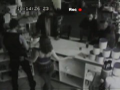 Security cam footage of a sexy brunnette giving head in a store