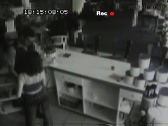 Security cam footage of a sexy brunnette giving head in a store