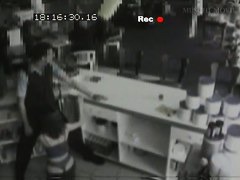 Security cam footage of a sexy brunnette giving head in a store