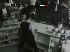 Security cam footage of a sexy brunnette giving head in a store