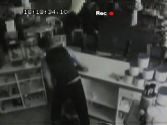 Security cam footage of a sexy brunnette giving head in a store