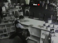 Security cam footage of a sexy brunnette giving head in a store