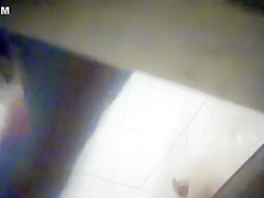 Sensual brunette gets naked before putting on her sexy clot