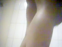 Sensual brunette gets naked before putting on her sexy clot