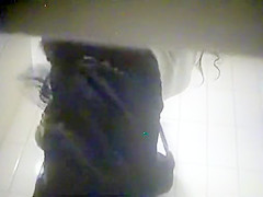 Sensual brunette gets naked before putting on her sexy clot