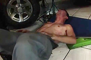 Shemale in latex plays with a dude by a car