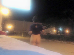Skinny stunner strips down and flashes her oiled pussy in public