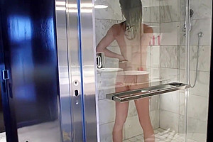 Smalltitted tranny showering while filmed