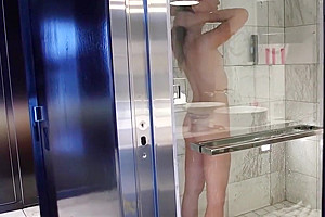 Smalltitted tranny showering while filmed