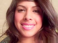 Smiling curvy teen 18+ licking her big boobies in close-up