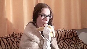 Spex brunette talking dirty while eating banana by Femdom Austria