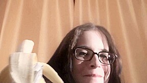Spex brunette talking dirty while eating banana by Femdom Austria