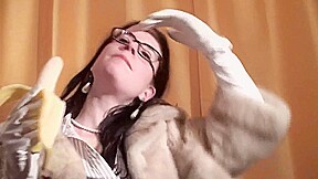Spex brunette talking dirty while eating banana by Femdom Austria