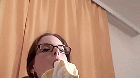 Spex brunette talking dirty while eating banana by Femdom Austria