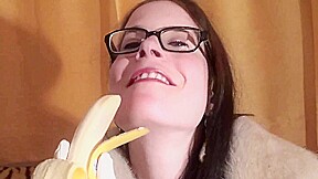 Spex brunette talking dirty while eating banana by Femdom Austria