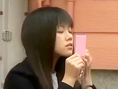 Spying a sexy asian girl fixing her makeup
