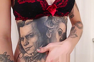 Tattooed tranny Gaby Ink tugging her big swollen cock