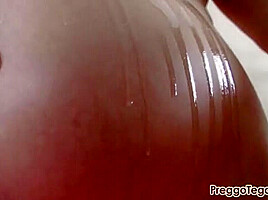 Tegan puts some baby oil on her body