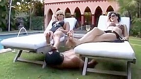Two dominant ladies with a foot slave