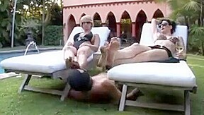 Two dominant ladies with a foot slave
