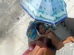 Under the sun umbrella handjob