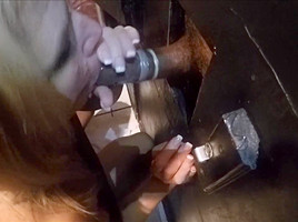Wife enjoys a BBC through glory hole 1
