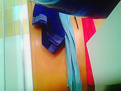 Woman drying herself and dressing panties
