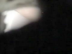 Woman pulls down her white pants and panties to pee