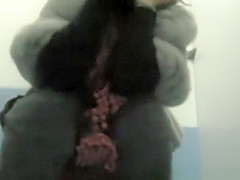 Woman with hairy pussy pissing