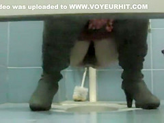 Woman with hairy pussy pissing