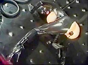 masked girl in latex gets anal training