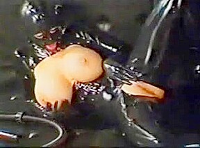 masked girl in latex gets anal training