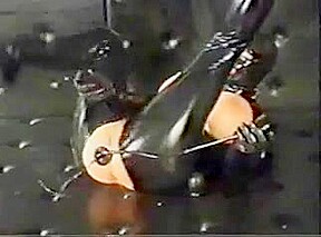 masked girl in latex gets anal training